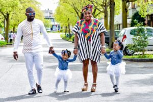 Photo by Charles Wilson: https://www.pexels.com/photo/positive-black-family-holding-hands-and-strolling-on-street-4299288/